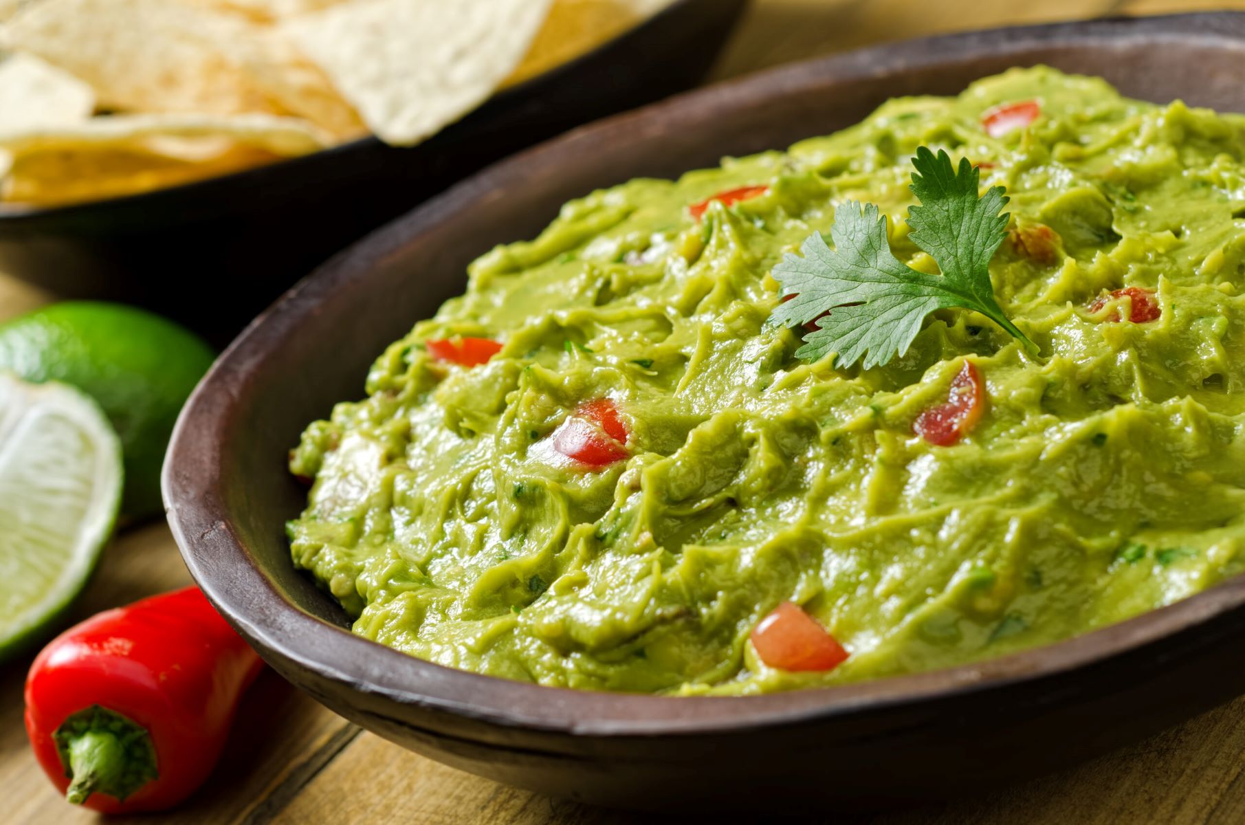 Delicious Guacamole With Fresh Tomatoes And Bell Peppers